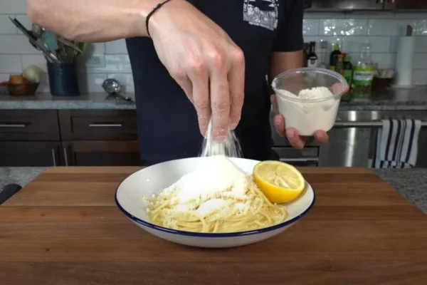 Chef cuts a lemon in half for his 10-minute pasta dish